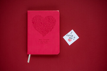 A book and a note with the words I love you, the best gift for a book lover. Valentine's Day,...