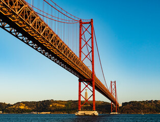 Impressive view of the 25 de Abril (25th April) suspension bridge crossing the Tagus river, Belem district, Lisbon, Portugal