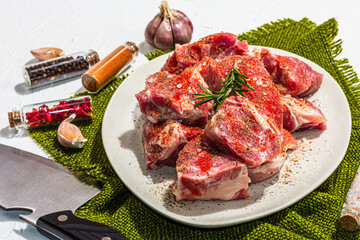 Raw pork loin pieces with ground spices. Fresh meat cut, ingredient for cooking protein food