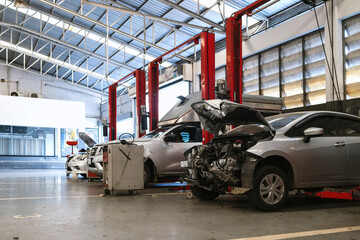 car repair in garage service station with soft-focus and over light in the background
