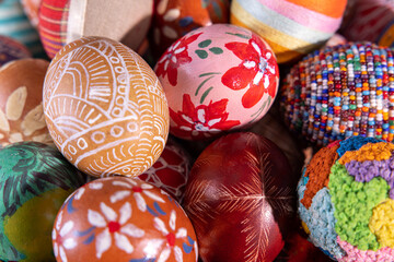 Close-up view from the top of the Easter eggs painted in various patterns.