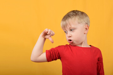 boy child shows his muscles