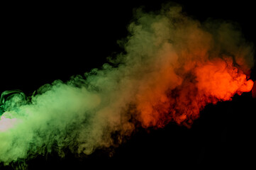 Red yellow green smoke on a black background.