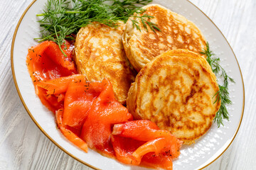 pancakes with sliced cold smoked salmon, top view