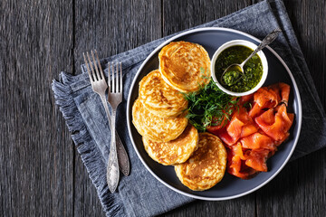 pancakes with sliced cold smoked salmon, top view