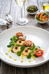 Prawn salad on wooden table
