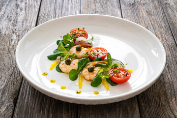 Prawn salad on wooden table
