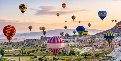 Fototapeta The great tourist attraction of Cappadocia - balloon flight. Cappadocia is known around the world as one of the best places to fly with hot air balloons. Goreme, Cappadocia, Turkey obraz