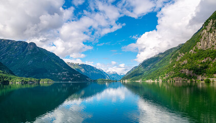Obraz na płótnie Canvas Amazing nature view with fjord and mountains. Beautiful reflection. Location: Scandinavian Mountains, Norway. Artistic picture. Beauty world. The feeling of complete freedom