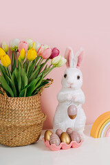 Spring flowers, Easter Bunny and eggs. Home interior with easter decor.   Children's room in the Easter style. Holidays decorations.