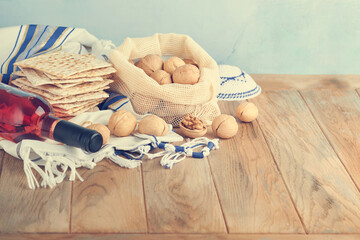 Passover celebration concept. Matzah, red kosher and walnut. Traditional ritual Jewish bread...