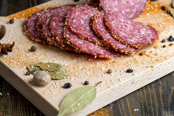 Sliced sausage with spices and lots of sesame seeds