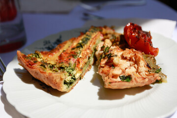 Tasty quiche cut in half in sun light
