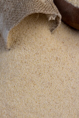 Semolina poured into a cotton bag ready for cooking