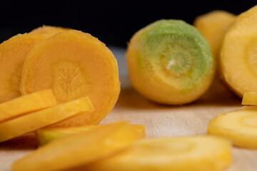 Pieces of sliced peeled carrots are yellow