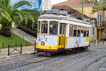 Naklejka na ściany i meble Classic View Of The Historic And Traditional Trams That Run Through The Famous Lisbon Street. Portugal, Europe