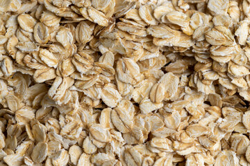 Poured a large amount of oat flakes close-up