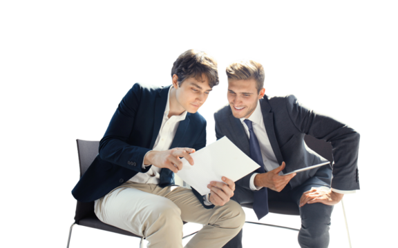 Mature businessman using a digital tablet to discuss information with a younger colleague in a modern business office.