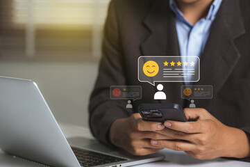 Customer service and satisfaction concept. Businessman choosing 5-star and happy smile face icon to give satisfaction in service for evaluation product service quality, feedback review, good quality.