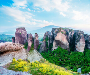 Naklejka premium magnificent magical landscape in the famous valley of the Meteora rocks in Greece at sunset. Great amazing world. Attractions.