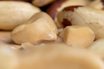 Fresh Brazil nuts peeled from the shell on the table