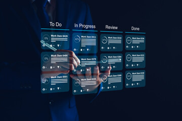 Agile software development or project management using kanban or scrum methodology boards on screen. Process, workflow, visual organisation tools and framework. Developer touching virtual interface.