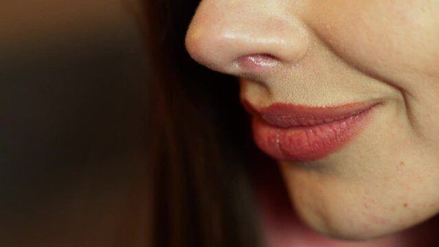 Close-up of the face, lips of a young woman.