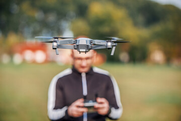 Man with flying drone. Concept of cybernetics and robotics