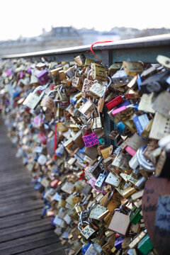 Colorful locks on the side of the bridge symbolic gesture for newly married couples in Europe