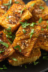 Baked accordion potato with parsley, garlic and herbs. Vegan healthy food