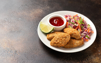 Vegetarian vegan southern fried nuggets served with sweet chilli sauce and cabbage salad