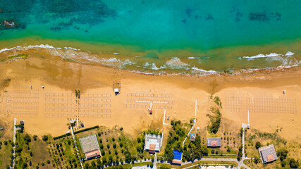 Obraz premium Relaxing aerial beach scene, summer vacation holiday template banner. Waves surf with amazing blue ocean, sea shore, coastline. Perfect aerial drone top view. Peaceful bright beach, seaside