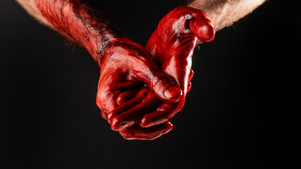Men's palms are stained with blood on a black background.