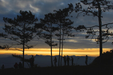 silhouette traveller at phukradueng national park mountain at sunrise