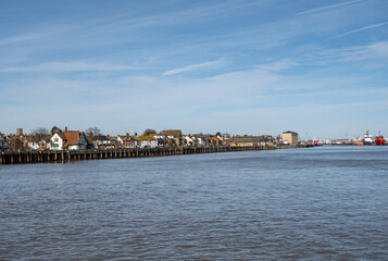 Fototapeta na wymiar View down the River Yare towards the seaside towns of Great Yarmouth on the East and Gorleston on the West. Captured on a bright and sunny day