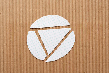 cut paper circle with the letter A on corrugated cardboard