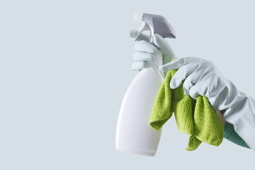 Cleaning service and solutions. Hands with gloves, green rags and spray bottle isolated on banner...