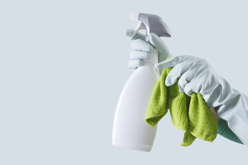 Cleaning service and solutions. Hands with gloves, green rags and spray bottle isolated on banner with copy space, search cleaning company online for a quote and support. Shopping products online.