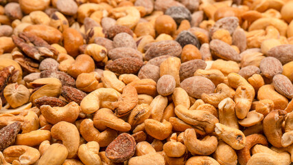 A group of almonds, pistachios, walnuts, macadamia, cashews.