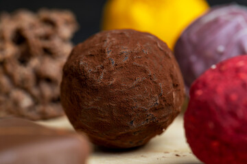 Chocolate sweet candy in the shape of a ball on the table