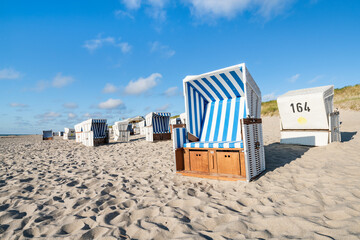 Summer vacation in a beach chair at the North Sea coast on Sylt, Schleswig-Holstein, Germany