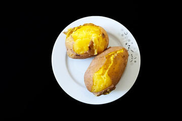 close-up of boiled whole potatoes in the plate,boiled large potatoes with the peel,