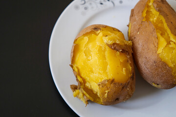 close-up of boiled whole potatoes in the plate,boiled large potatoes with the peel,