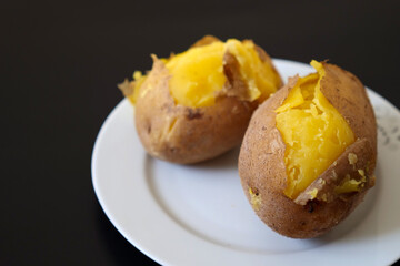 whole boiled potato, large boiled potato with skins,