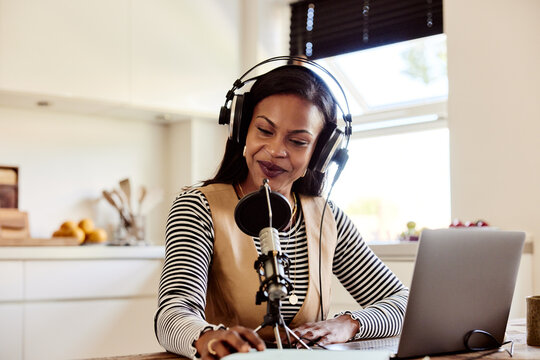 Woman smiling during a podcast