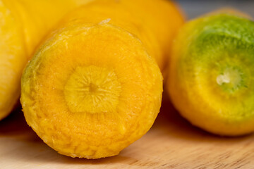 Sliced bright yellow carrots on the table