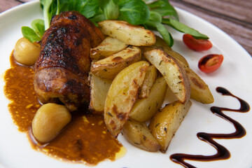 Recipe for boneless rolled chicken leg with potatoes and molasses-flavoured mache salad, High quality photo