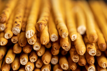 Thin and long bread sticks made of wheat flour on the table