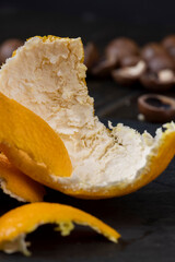 Peel of ripe peeled tangerines scattered on the table