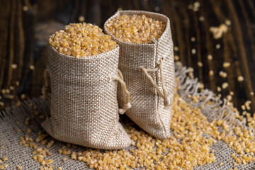 Not cooked wheat porridge in a linen bag